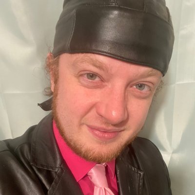 luke wenke cyberstalker black biker cap smiling ugly 2025